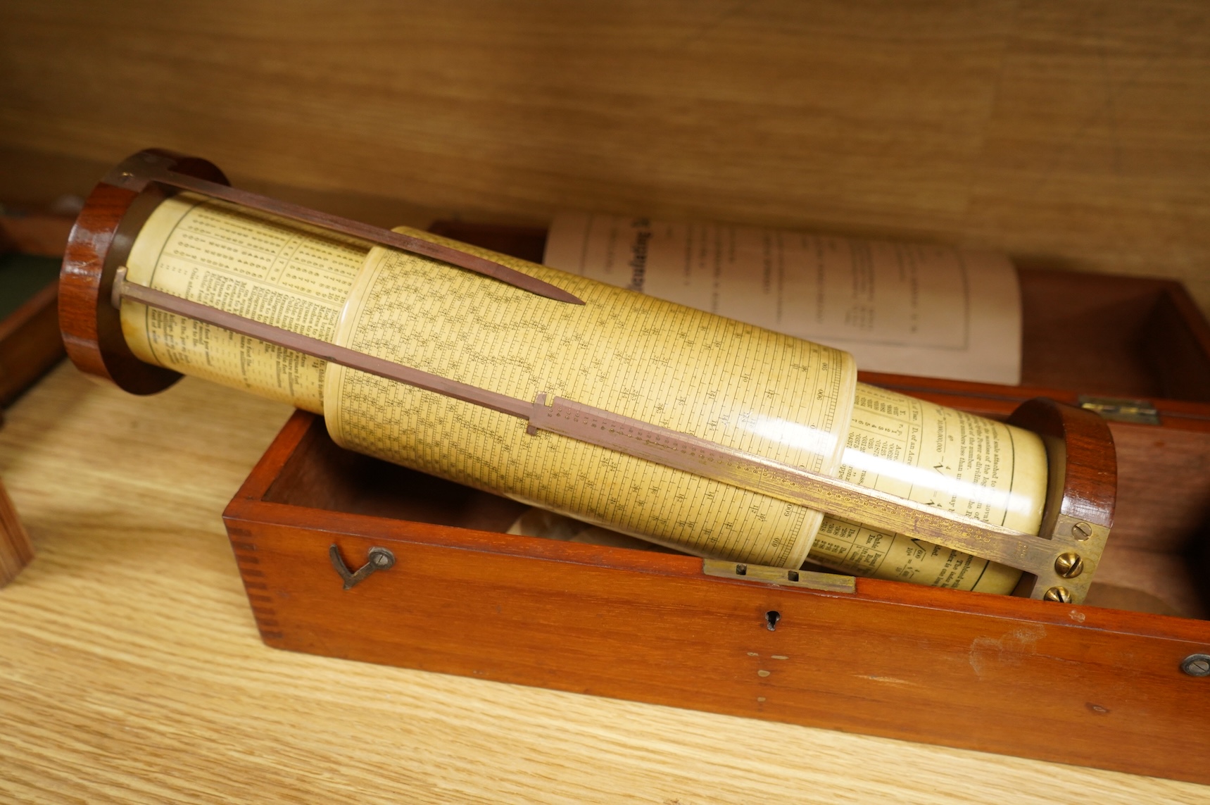 A brass and glass thermometer, with an ash handle, together with an early 19th century brass mining theodolite, by William Wilton, St. Day, Cornwall, (2)